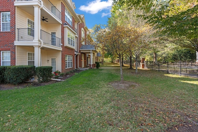 3201 Aspen Grove Dr Unit L8, Franklin, TN 37067 - view of yard with fence, a ceiling fan, and a balcony