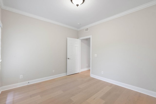 3201 Aspen Grove Dr Unit L8, Franklin, TN 37067 - empty room with baseboards, visible vents, ornamental molding, and light wood finished floors