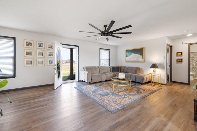 1883 Sawgrass Ln, Chapel Hill, TN 37034 - living room with wood finished floors, a ceiling fan, and baseboards