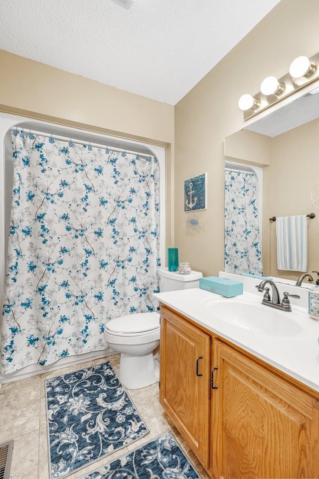bathroom with toilet, a textured ceiling, vanity, and a shower with shower curtain