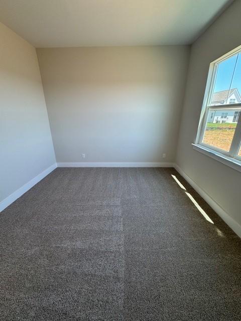 5738 Lennis Ln, Murfreesboro, TN 37129 - spare room featuring dark carpet