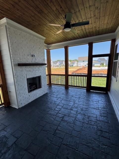 5738 Lennis Ln, Murfreesboro, TN 37129 - unfurnished living room featuring a ceiling fan, wooden ceiling, an outdoor brick fireplace, and crown molding