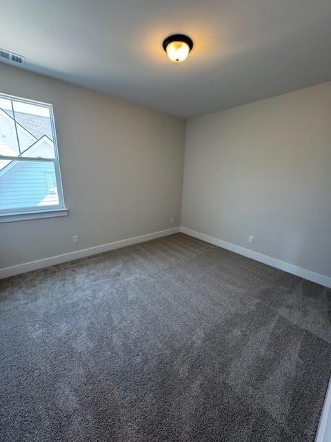 5738 Lennis Ln, Murfreesboro, TN 37129 - carpeted empty room with baseboards