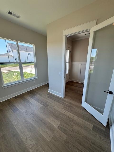 5738 Lennis Ln, Murfreesboro, TN 37129 - unfurnished bedroom with dark wood-style flooring and wainscoting