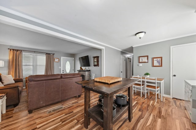 102 Lakeside Dr, Columbia, TN 38401 - dining room with baseboards, ornamental molding, and light wood-type flooring
