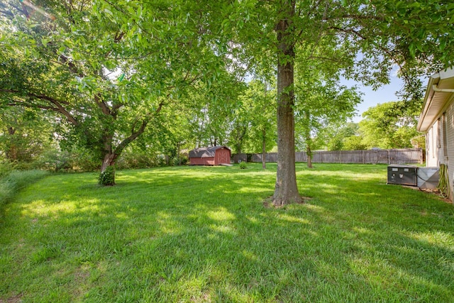 102 Lakeside Dr, Columbia, TN 38401 - view of yard featuring an outbuilding, a fenced backyard, and a shed
