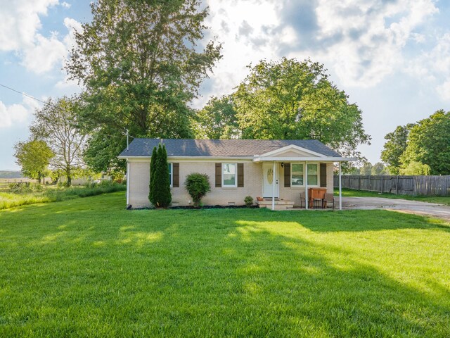 102 Lakeside Dr, Columbia, TN 38401 - ranch-style house featuring brick siding, fence, driveway, and a front yard