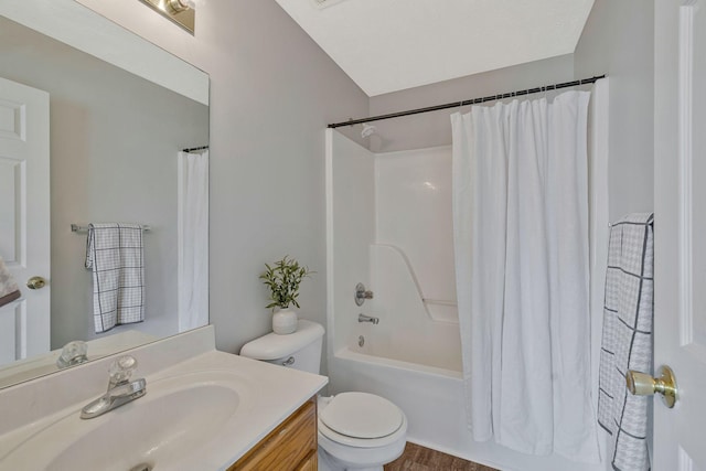 bathroom featuring shower / bathtub combination with curtain, toilet, and vanity