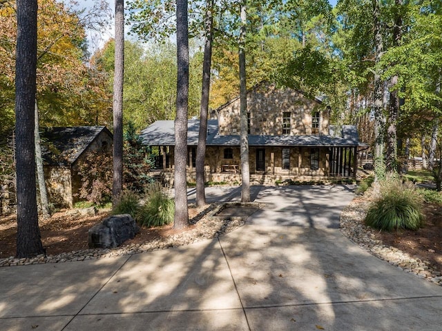 view of front of property with a porch and stone siding