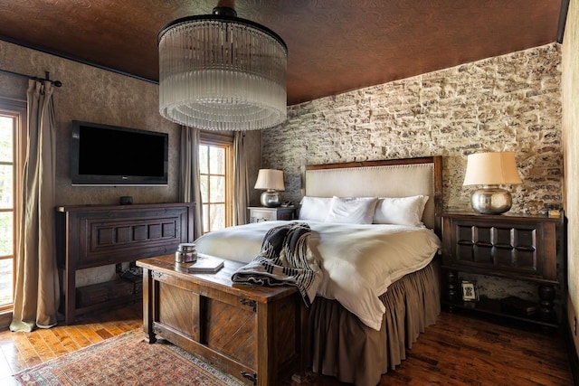 bedroom with hardwood / wood-style floors