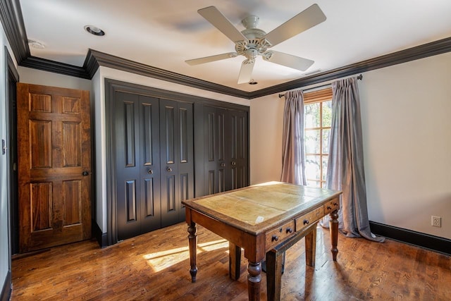 office space with wood finished floors, ceiling fan, and crown molding