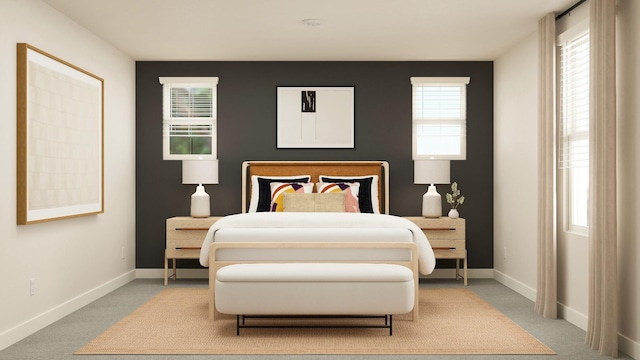 bedroom with carpet flooring and baseboards