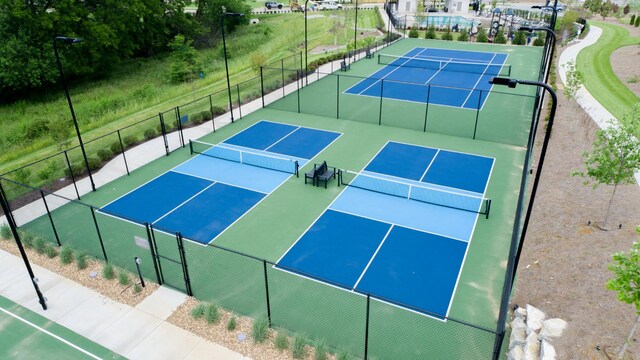 view of sport court with fence