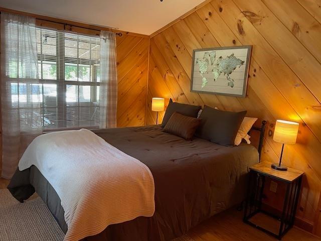 bedroom with wood finished floors