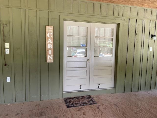 view of exterior entry with board and batten siding