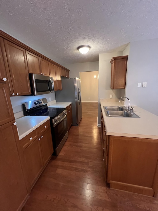 800 Browns Ln Unit L2, Gallatin, TN 37066 - kitchen with light countertops, appliances with stainless steel finishes, dark wood-style flooring, and a sink