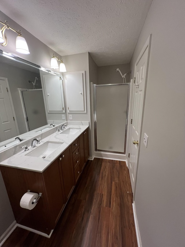 800 Browns Ln Unit L2, Gallatin, TN 37066 - full bathroom with a stall shower, a sink, and wood finished floors
