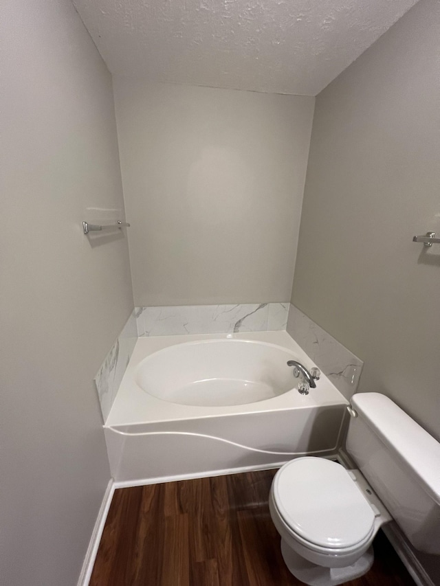 800 Browns Ln Unit L2, Gallatin, TN 37066 - full bath featuring toilet, a textured ceiling, a bath, and wood finished floors