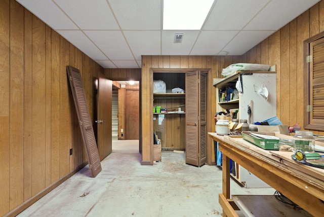 1331 Hutcheson Ln, Clarksville, TN 37040 - interior space featuring wooden walls, unfinished concrete floors, and a drop ceiling