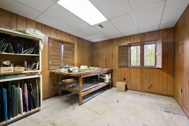 1331 Hutcheson Ln, Clarksville, TN 37040 - dining area featuring baseboards, wooden walls, concrete floors, and a paneled ceiling