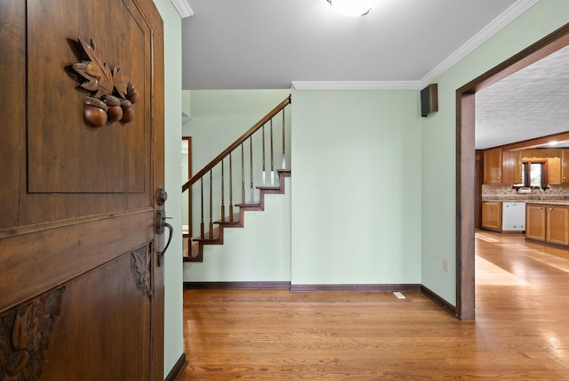 1331 Hutcheson Ln, Clarksville, TN 37040 - foyer entrance featuring stairway, ornamental molding, light wood-style flooring, and baseboards