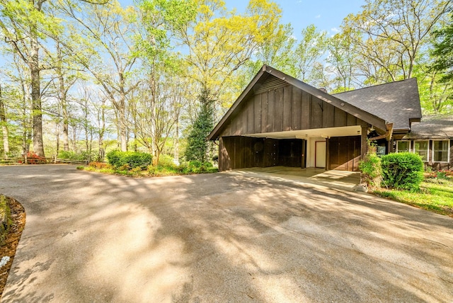 1331 Hutcheson Ln, Clarksville, TN 37040 - view of home's exterior featuring roof with shingles, a carport, and concrete driveway
