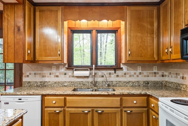 1331 Hutcheson Ln, Clarksville, TN 37040 - kitchen with a healthy amount of sunlight, tasteful backsplash, white appliances, and a sink