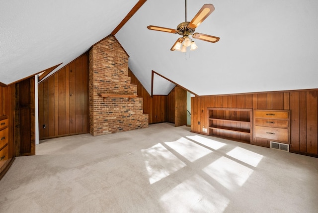 1331 Hutcheson Ln, Clarksville, TN 37040 - bonus room with a ceiling fan, visible vents, vaulted ceiling, wood walls, and carpet floors
