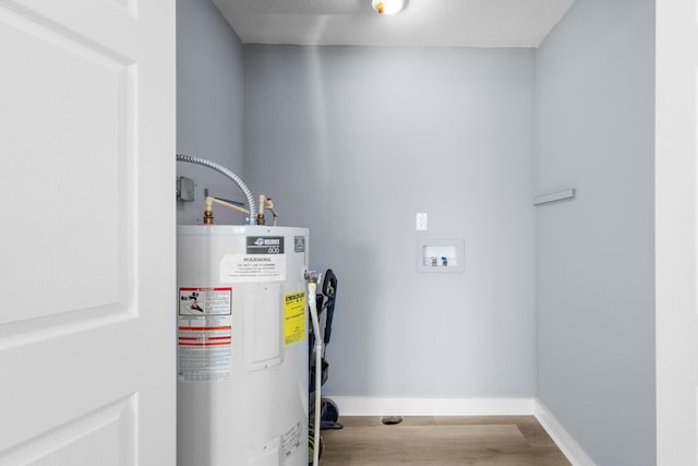utility room featuring water heater