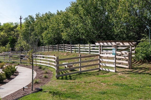 view of gate with fence
