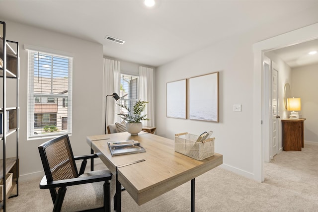 office space featuring baseboards, visible vents, light carpet, and recessed lighting