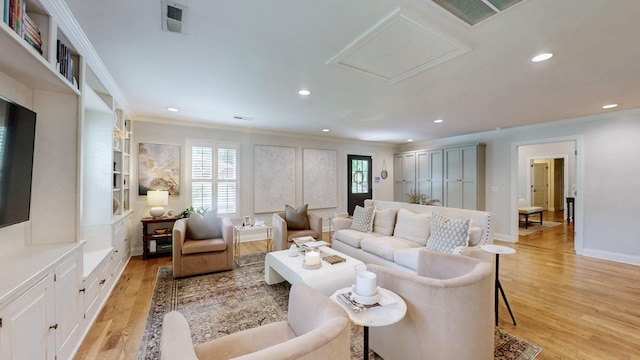 living room featuring crown molding, light wood finished floors, recessed lighting, and visible vents