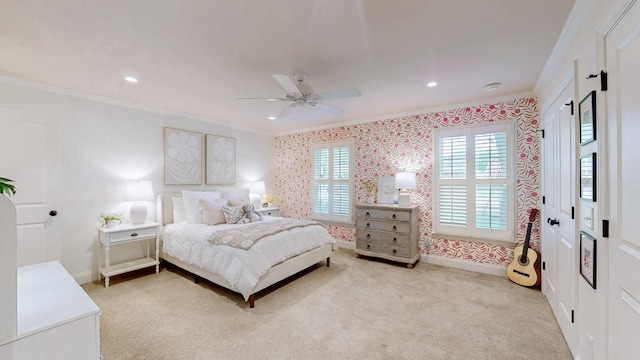 bedroom with baseboards, wallpapered walls, light colored carpet, and crown molding