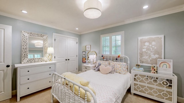bedroom featuring crown molding, recessed lighting, and a closet