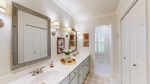 full bathroom featuring ornamental molding, a closet, and a sink