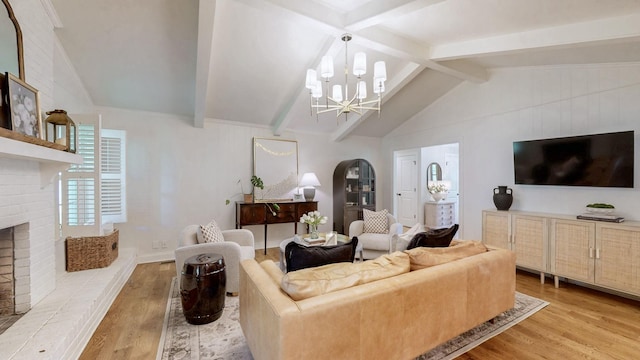 living area with a chandelier, arched walkways, a fireplace, wood finished floors, and vaulted ceiling with beams