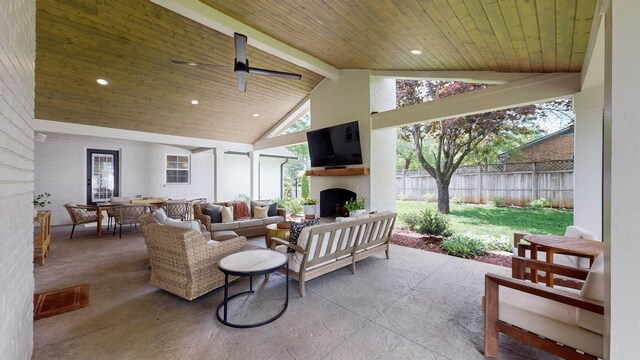 view of patio with outdoor dining area, an outdoor living space with a fireplace, ceiling fan, and fence