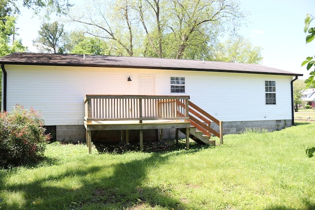 back of house featuring crawl space and a wooden deck