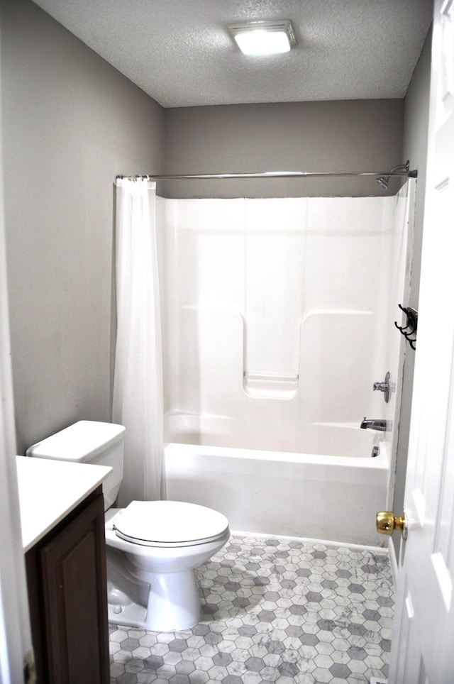 full bath with shower / bathtub combination with curtain, vanity, toilet, and a textured ceiling