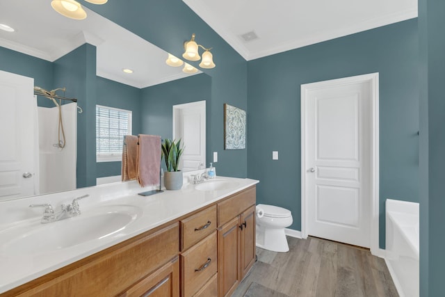 full bath featuring visible vents, a sink, wood finished floors, and ornamental molding