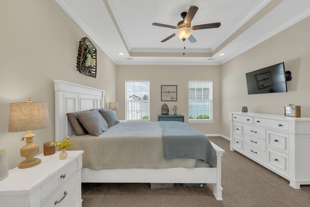 bedroom featuring carpet floors, ornamental molding, recessed lighting, a raised ceiling, and a ceiling fan