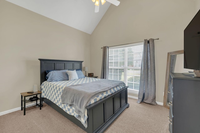 bedroom with high vaulted ceiling, baseboards, light carpet, and a ceiling fan