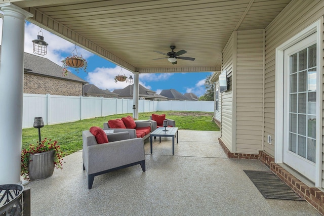 view of patio with a fenced backyard, ceiling fan, and outdoor lounge area