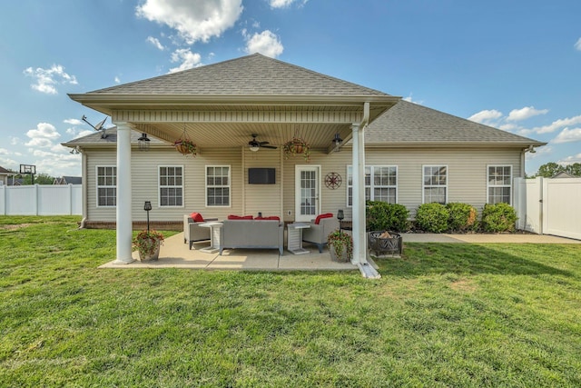 back of house with ceiling fan, an outdoor living space, a fenced backyard, and roof with shingles