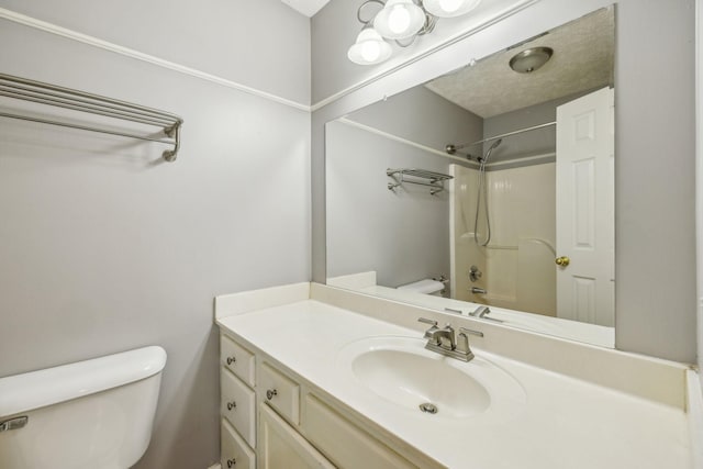 full bathroom featuring vanity, bathtub / shower combination, and toilet