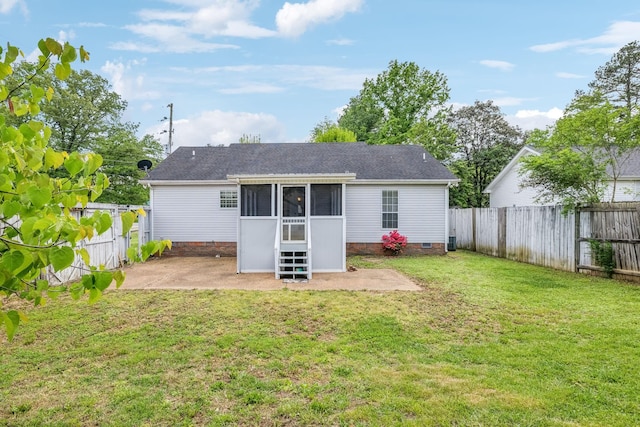 rear view of property with a fenced backyard, a sunroom, a patio area, and crawl space