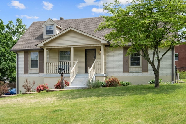 93 Hilltop Dr, Columbia, TN 38401 - view of front of house featuring roof with shingles, fence, brick siding, a porch, and a front yard