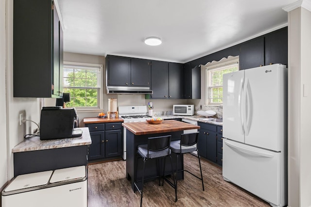 93 Hilltop Dr, Columbia, TN 38401 - kitchen featuring white appliances, wooden counters, wood finished floors, under cabinet range hood, and a kitchen island