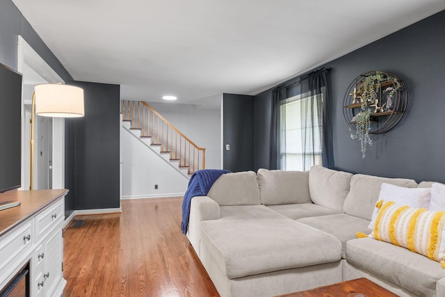93 Hilltop Dr, Columbia, TN 38401 - living area featuring baseboards, stairway, and light wood-type flooring