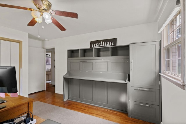 93 Hilltop Dr, Columbia, TN 38401 - unfurnished living room featuring ceiling fan, wood finished floors, and a healthy amount of sunlight